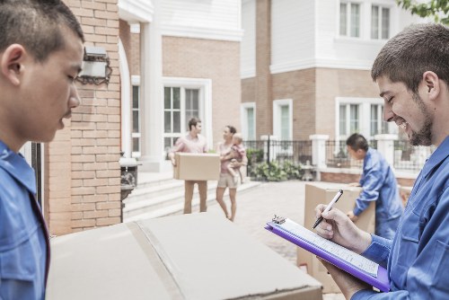 Furniture removals team handling household items in Highbury