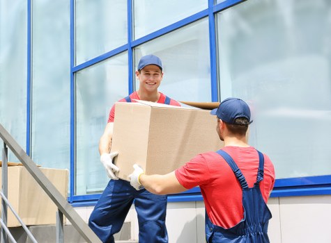 Student removals team loading boxes in Highbury near a residential flat