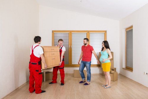 Careful loading of household items into a removals van in Highbury