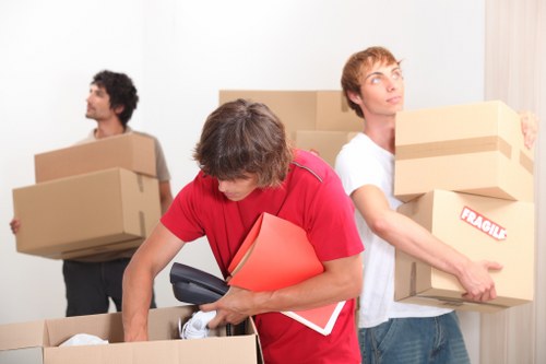Professional movers assisting with flat furniture removals in Highbury
