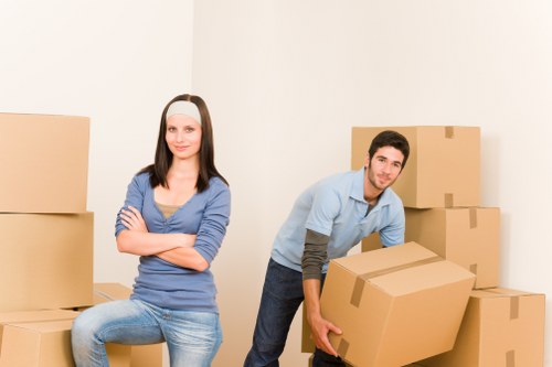 Professional house removalists loading furniture in Highbury