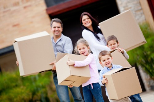 Local office movers handling desks and equipment during a Highbury relocation
