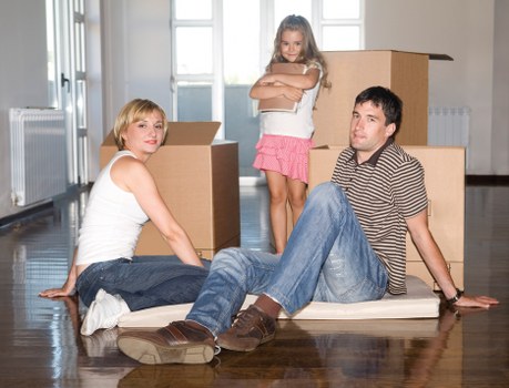 Trained removal staff handling furniture carefully during a Highbury move